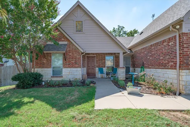 front view of a house with a yard