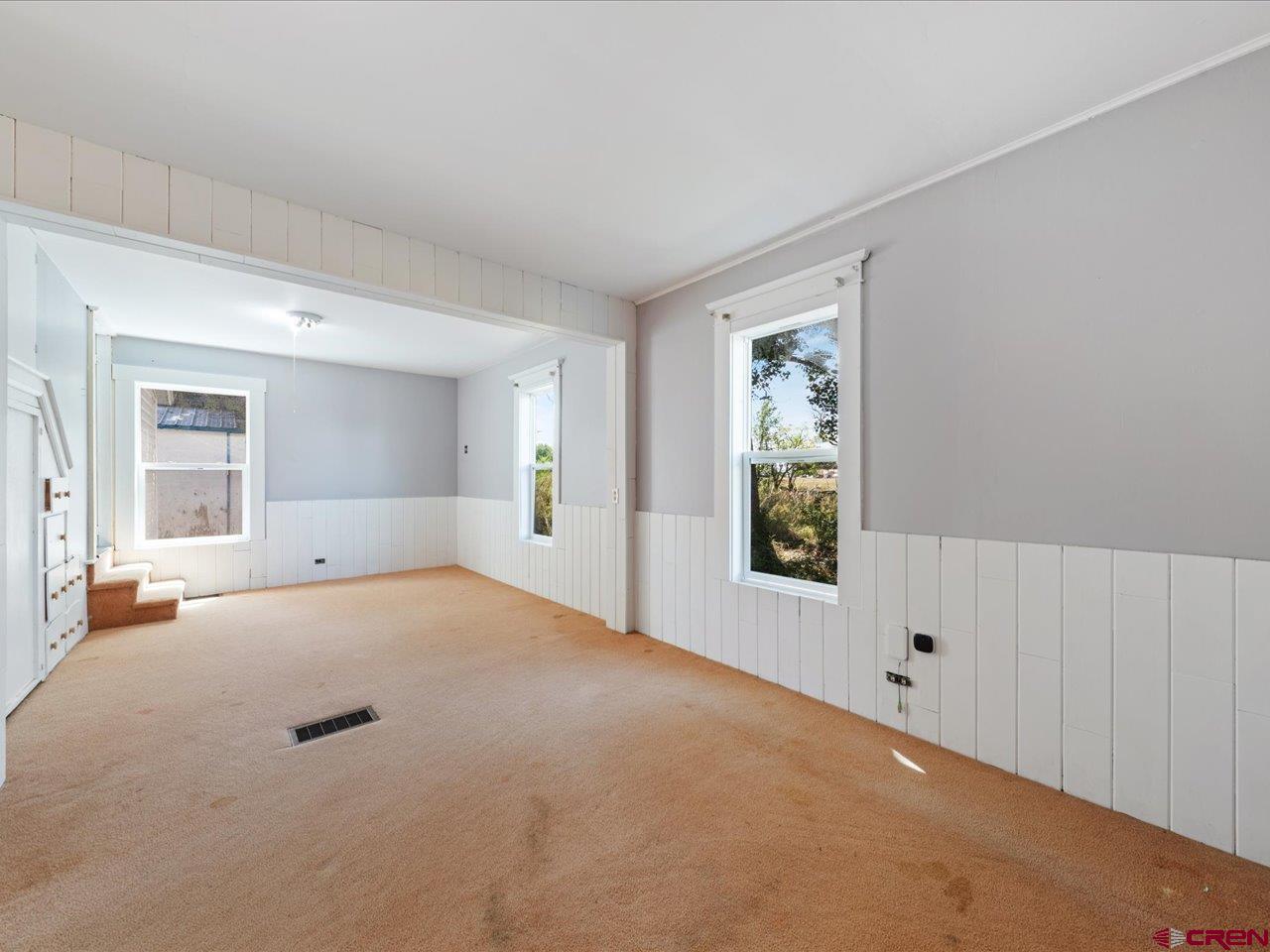 35826 Highway 145 Redvale, CO 81431 - Photo 12 of 22 a view of an empty room with window and wooden floor