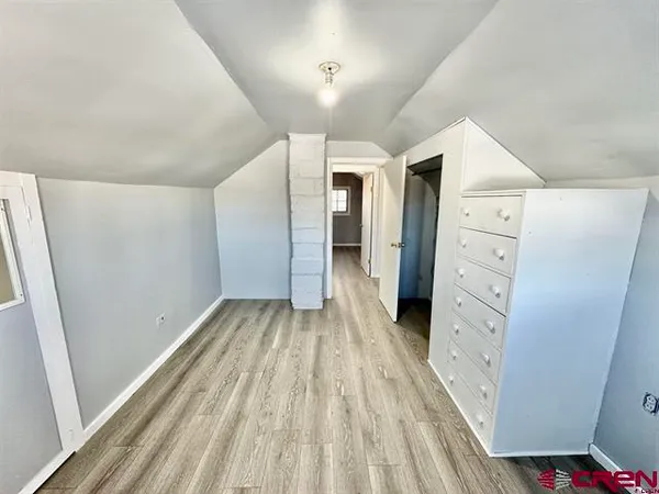 a view of a bedroom with closet