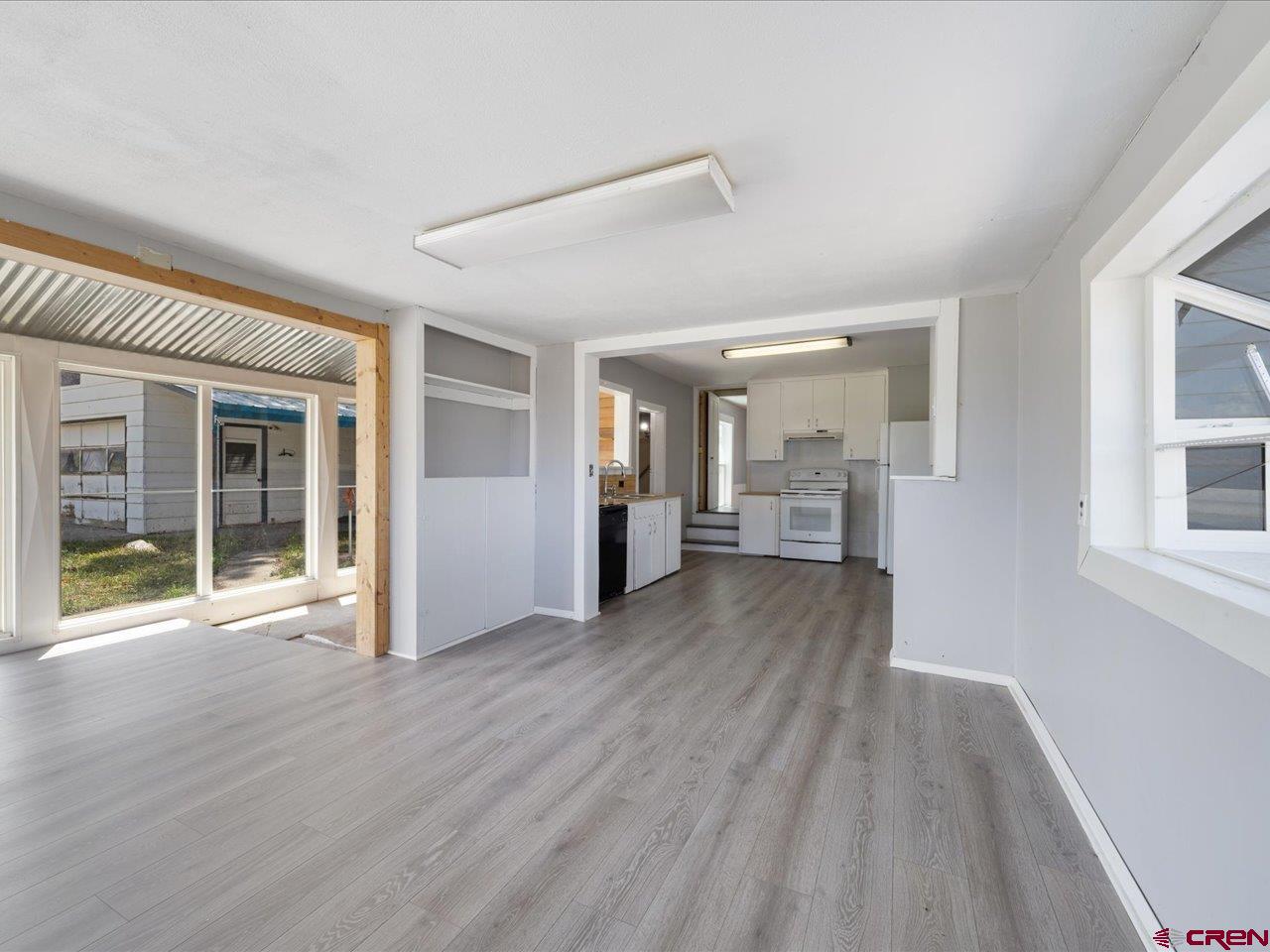 35826 Highway 145 Redvale, CO 81431 - Photo 4 of 22 a view of a big room with wooden floor and windows