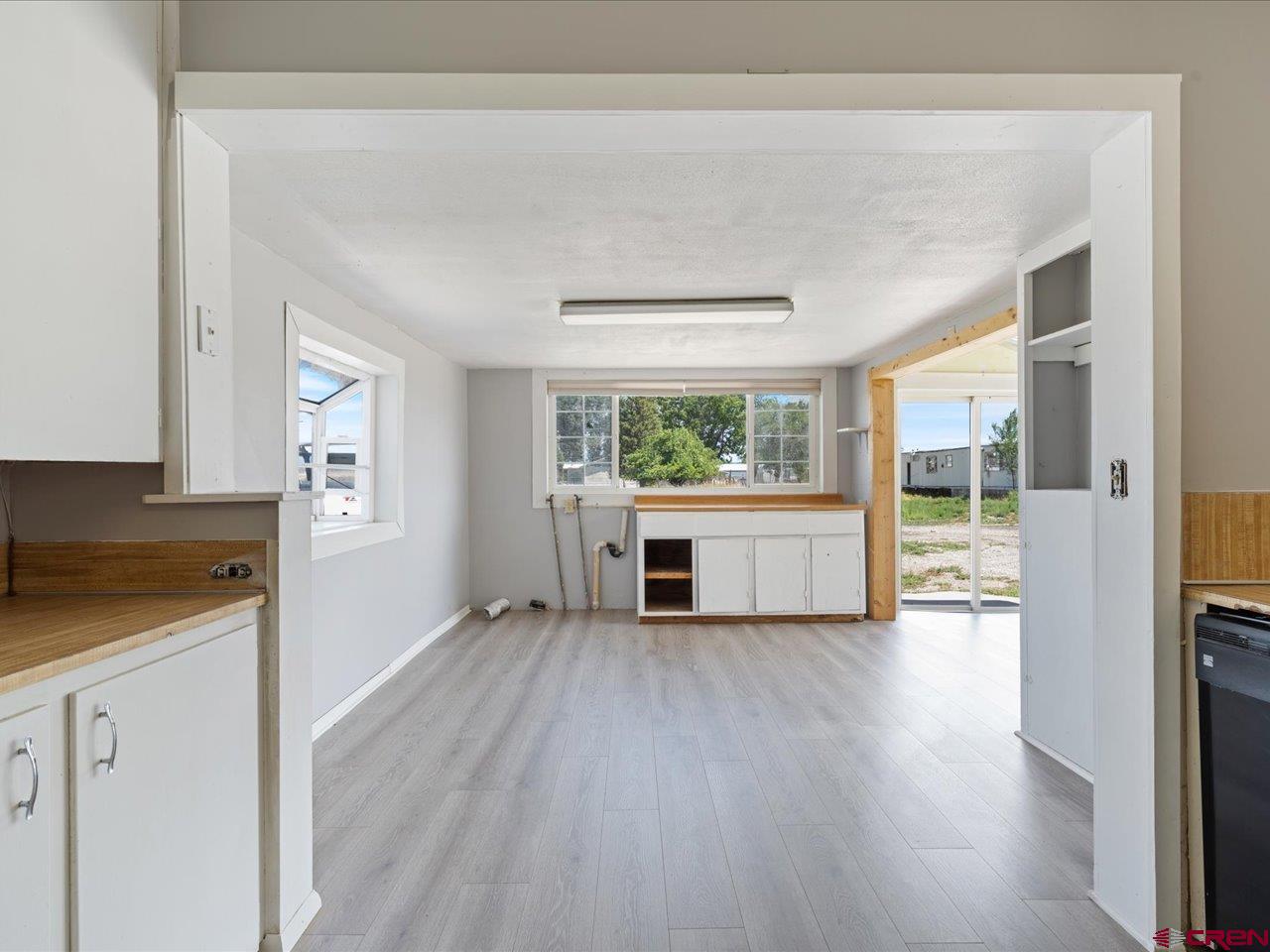 35826 Highway 145 Redvale, CO 81431 - Photo 5 of 22 a view of a kitchen with wooden floor and electronic appliances