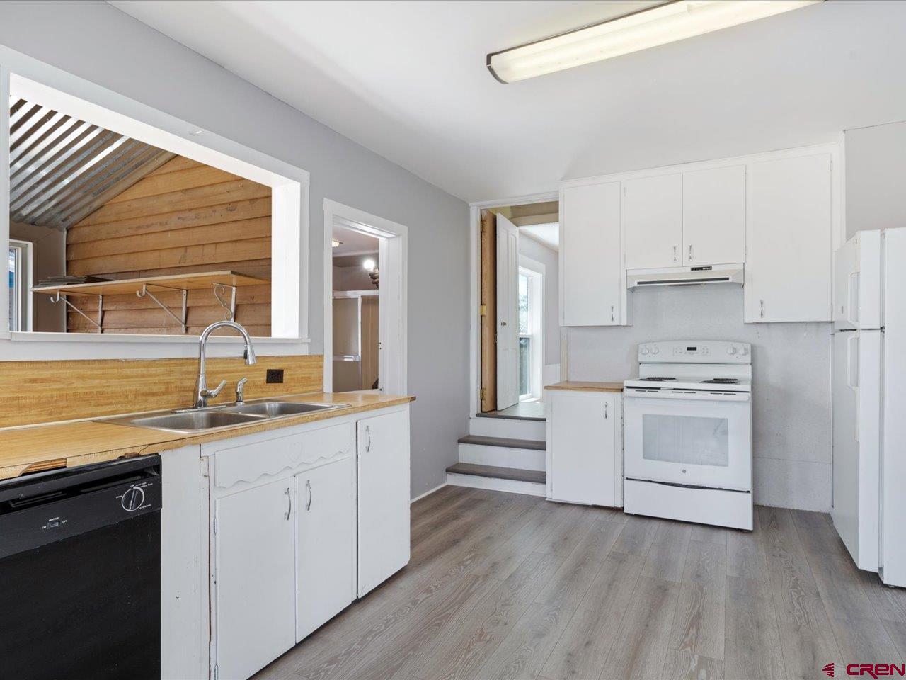35826 Highway 145 Redvale, CO 81431 - Photo 6 of 22 a kitchen with granite countertop a sink cabinets stainless steel appliances and window