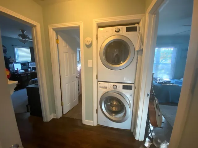a view of a hallway with washer and dryer