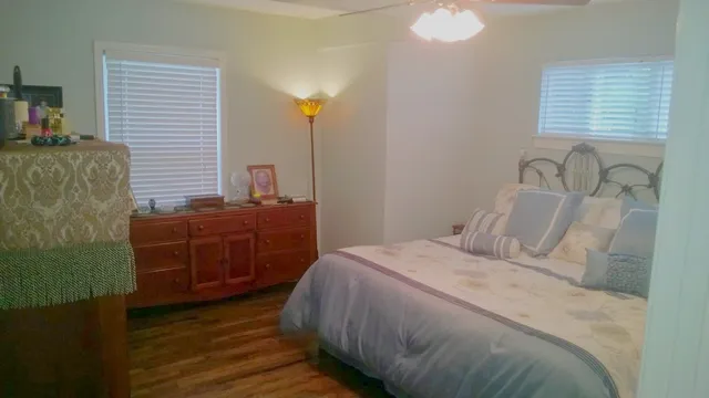 a bedroom with a bed and a dresser