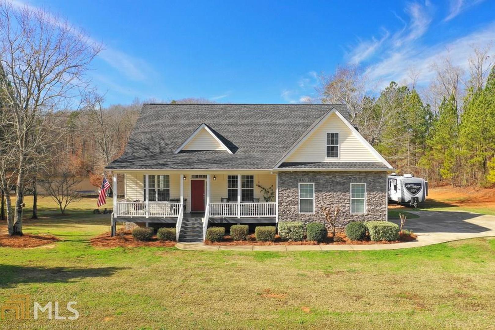 5534 Roberts Quarters Road Molena, GA 30258 - Photo 1 of 1 a view of a house with swimming pool next to a yard