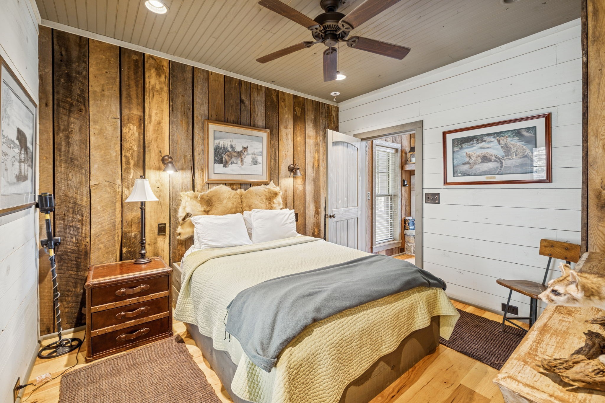 935 Leatherwood Creek Road Pulaski, TN 38478 - Photo 30 of 36 a bedroom with a bed and a chandelier