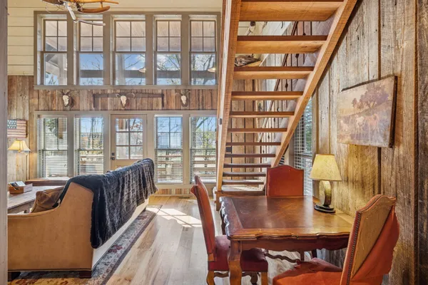 a room with lots of furniture and windows