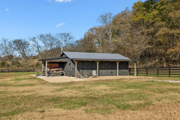 a kitchen with stainless steel appliances granite countertop a refrigerator and a stove