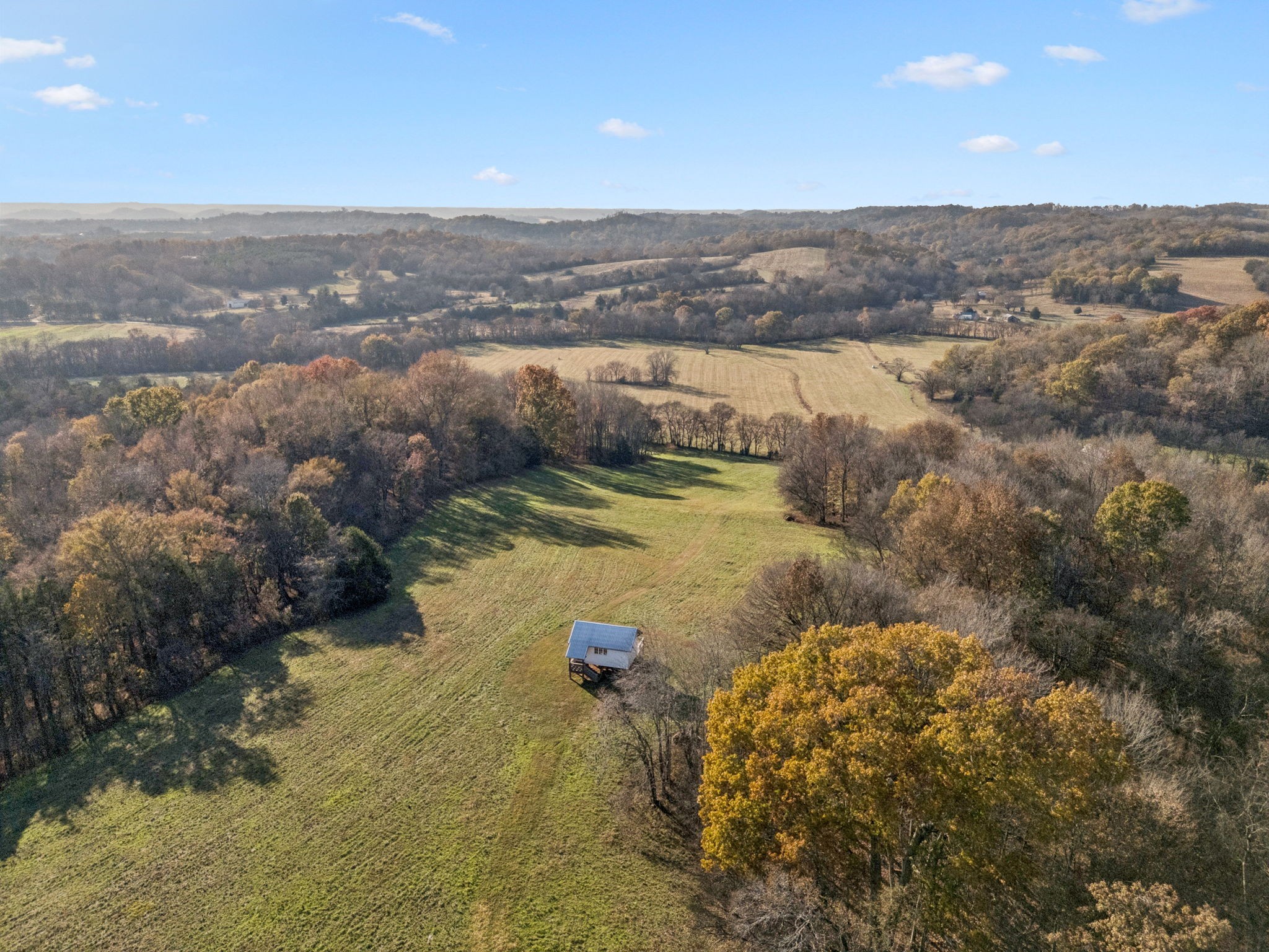 935 Leatherwood Creek Road Pulaski, TN 38478 - Photo 7 of 36 a view of a lake with mountains in the background