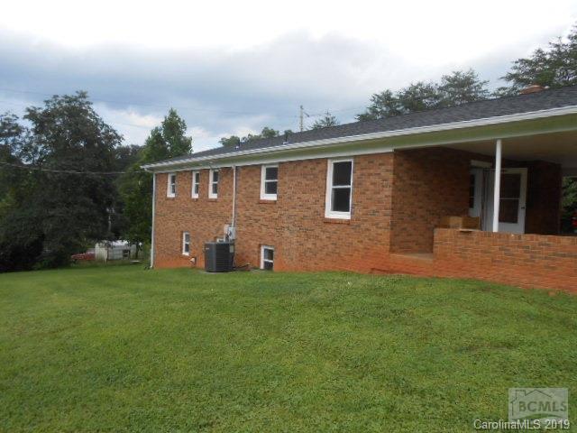 4808 Dentons Chapel Road Morganton, NC 28655 - Photo 13 of 20 a front view of house with yard and trees in the background