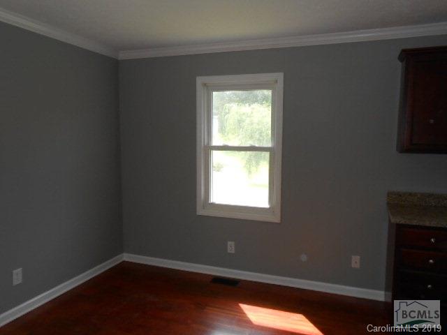 4808 Dentons Chapel Road Morganton, NC 28655 - Photo 20 of 20 a view of an empty room with wooden floor and a window