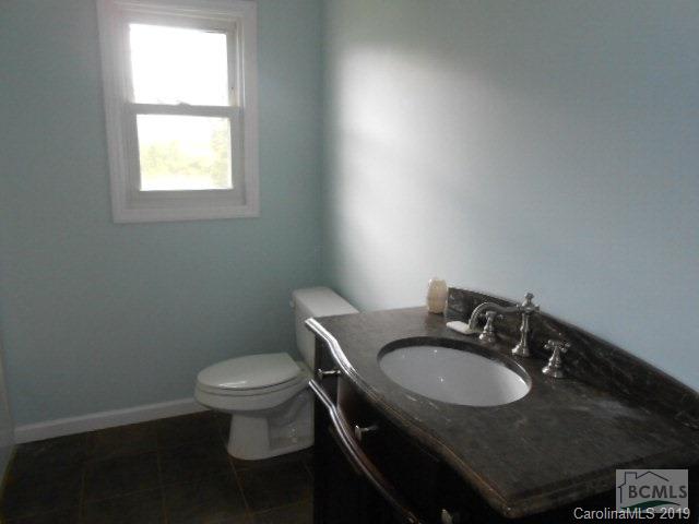 4808 Dentons Chapel Road Morganton, NC 28655 - Photo 7 of 20 a bathroom with a sink toilet and a window