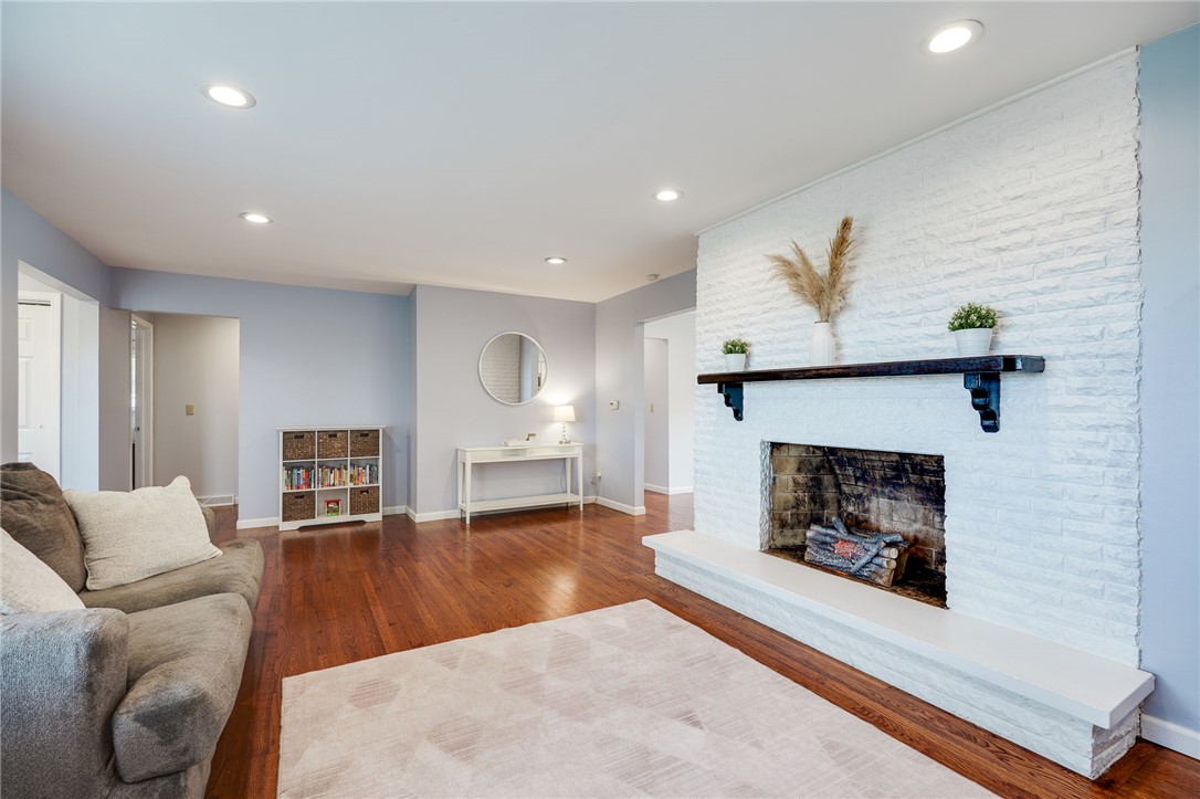 6950 Red Lion 5 Points Road Springboro, OH 45066 - Photo 15 of 78 This inviting living space features warm hardwood floors and a striking fireplace.