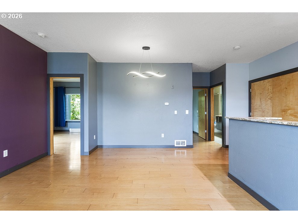622 South Nevada Street, Unit D Portland, OR 97219 - Photo 14 of 37 a view of an empty room with glass door and a window