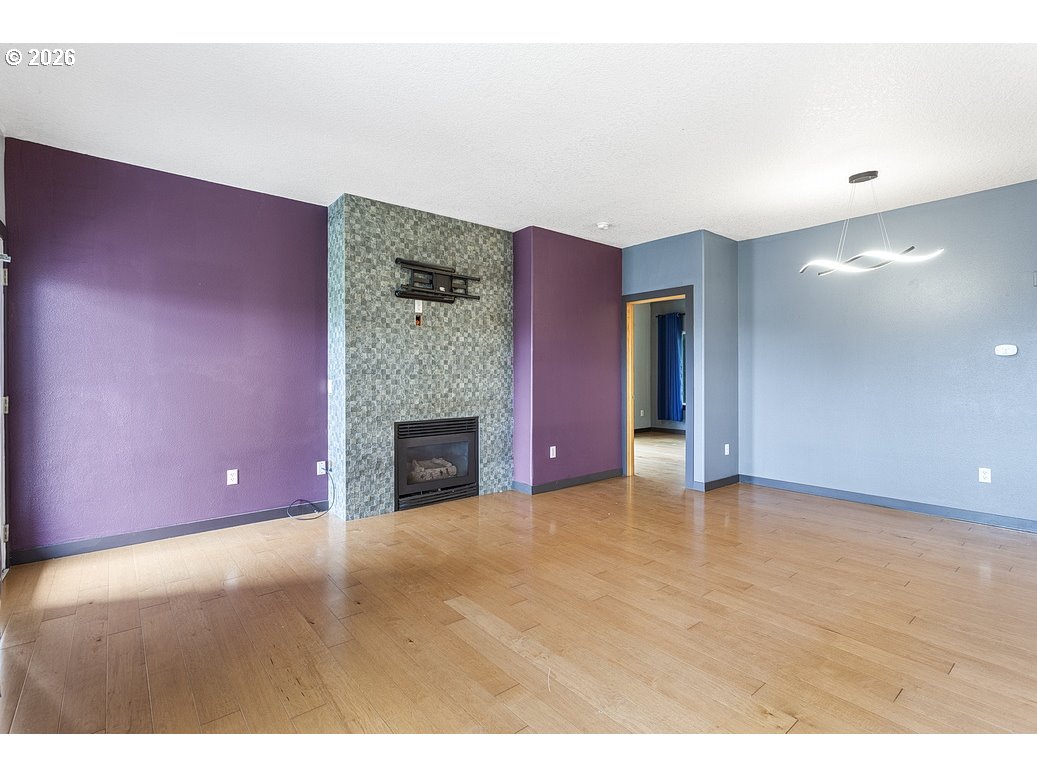 622 South Nevada Street, Unit D Portland, OR 97219 - Photo 17 of 37 a view of empty room with a fireplace
