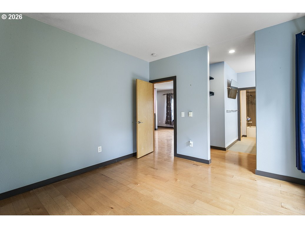 622 South Nevada Street, Unit D Portland, OR 97219 - Photo 22 of 37 a view of an empty room and fire place