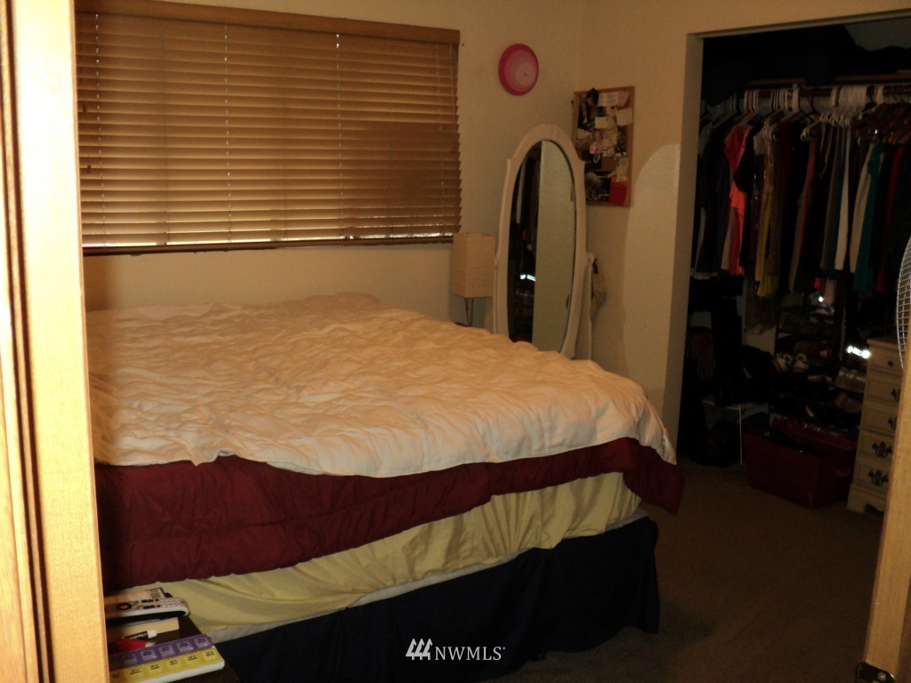 24302 Carter Road Bothell, WA 98021 - Photo 4 of 10 a bedroom with a bed and a closet