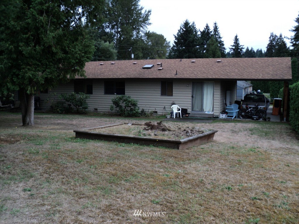24302 Carter Road Bothell, WA 98021 - Photo 10 of 10 a view of a house with a sink and backyard