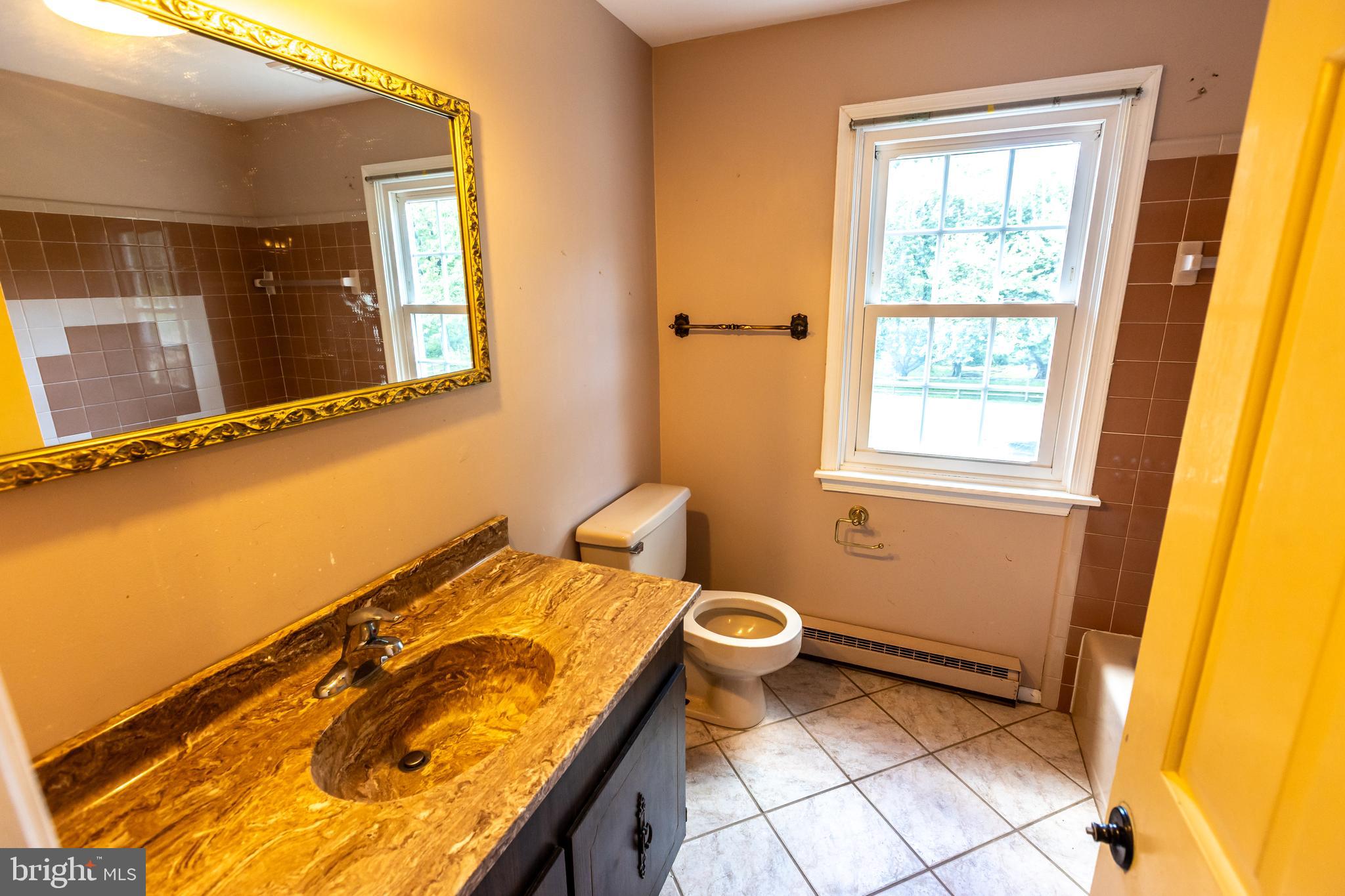 1929 Hillendale Road Chadds Ford, PA 19317 - Photo 42 of 56 a bathroom with a sink and a toilet