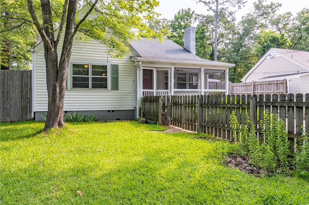 726 Charlton Street Northwest Rome, GA 30165 - Photo 1 of 1 a front view of a house with a yard