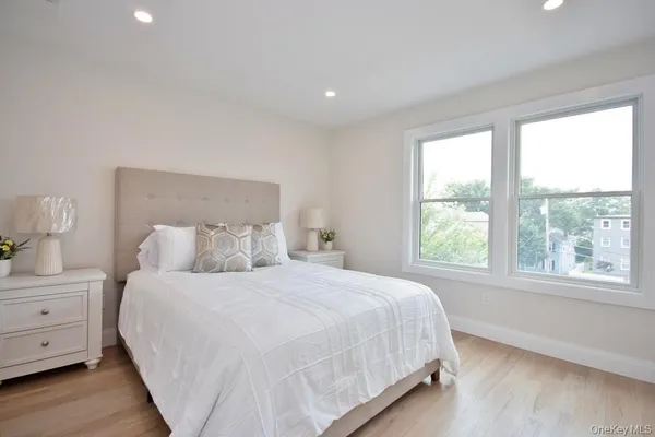 a bedroom with a large bed and a window