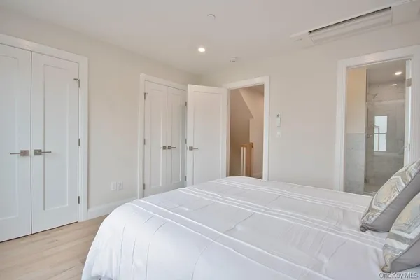 a bedroom with a bed and a hallway