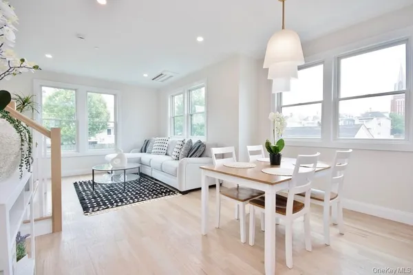 a living room with furniture and a table