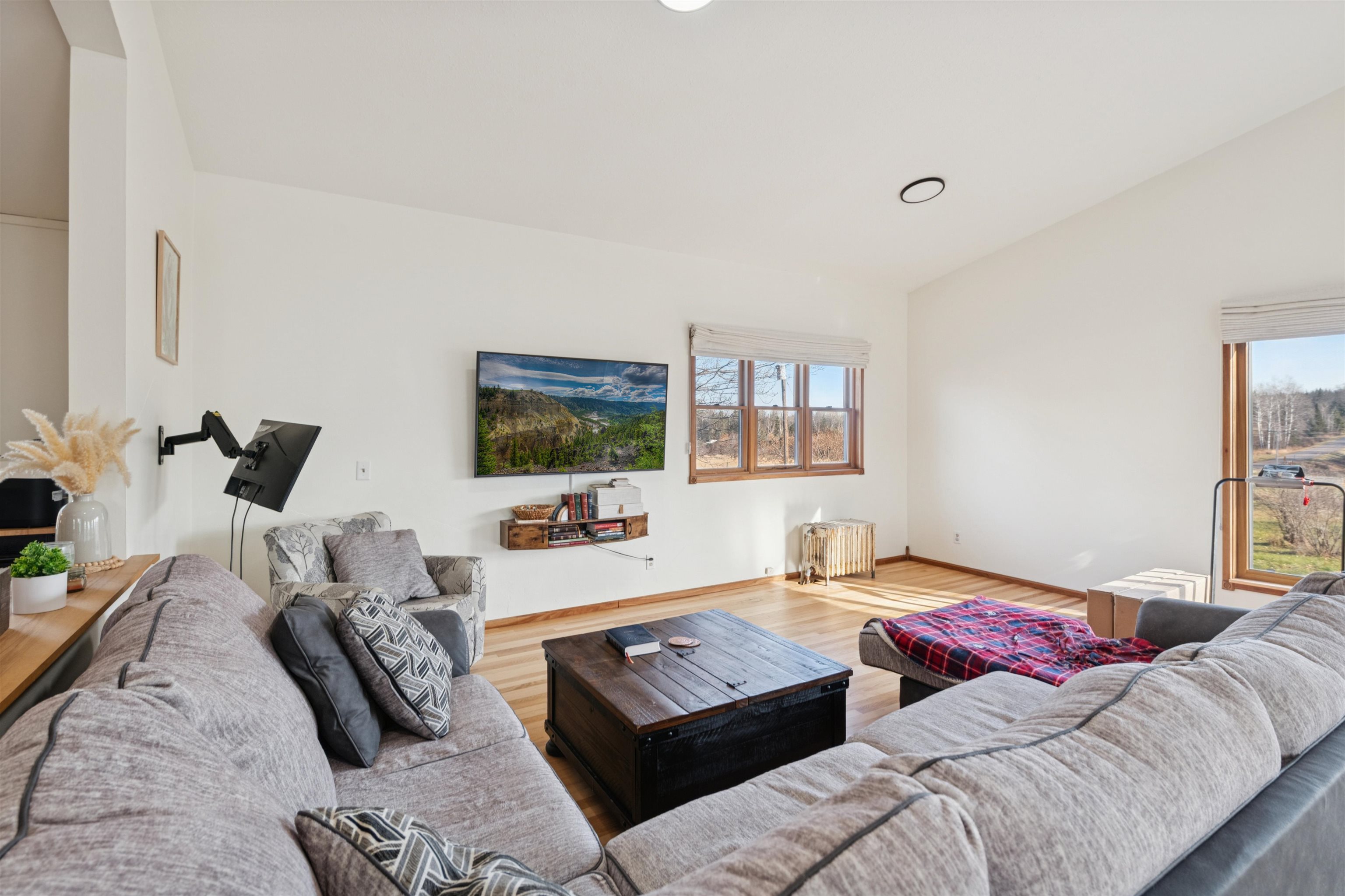 19805 Keystone Road Mason, WI 54856 - Photo 13 of 25 Living room with vaulted ceiling and wood finished floors