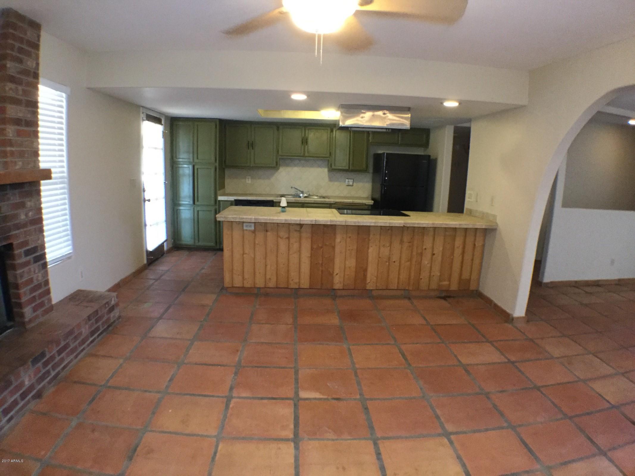 13816 South Kiva Road Buckeye, AZ 85326 - Photo 3 of 31 fireplace kitchen
