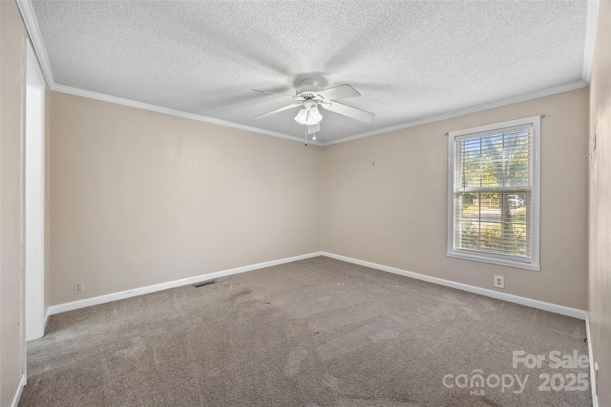 4640 Mel Nunnery Road Fort Lawn, SC 29714 - Photo 18 of 37 an empty room with windows and fan