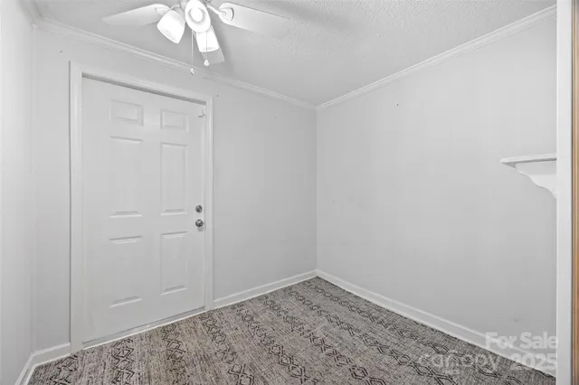 a view of a garage with gym equipment