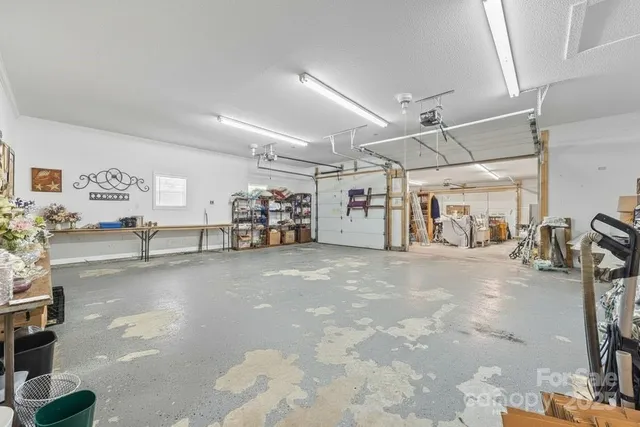 a balcony with wooden floor outdoor seating and yard in the back