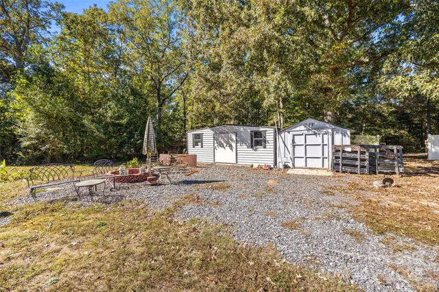 a view of a house with snow on the road