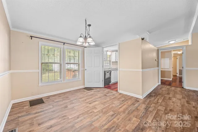a view of a livingroom with wooden floor