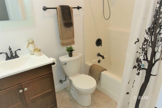 1516 Mayo Street Ridgecrest, CA 93555 - Photo 27 of 33 a bathroom with a sink toilet and shower