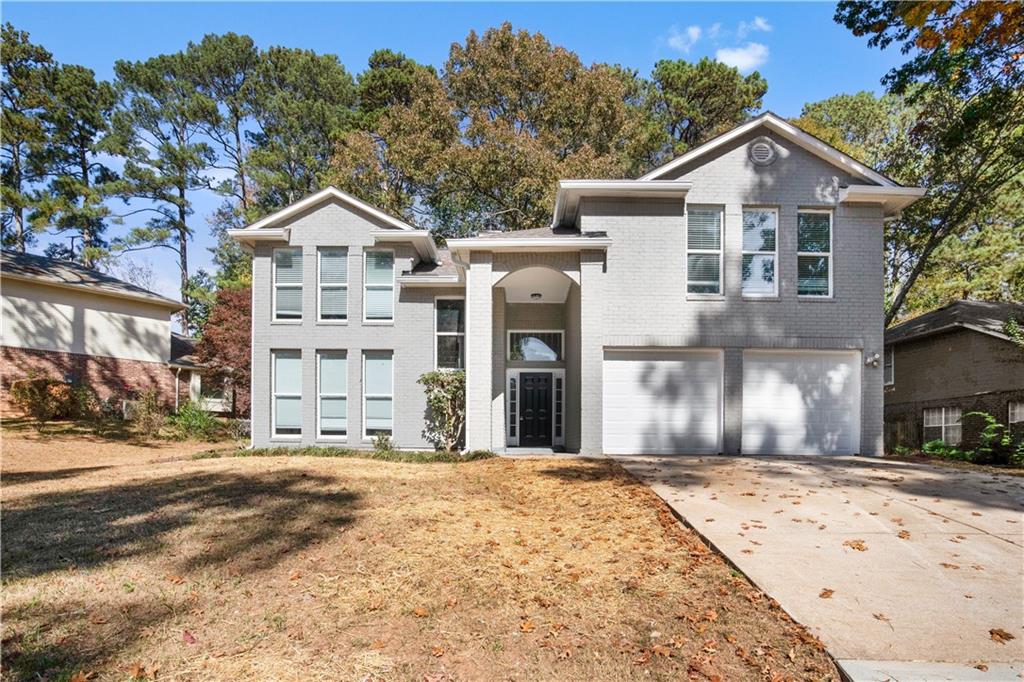 668 Woodstone Road Lithonia, GA 30058 - Photo 1 of 1 View of front of house featuring a garage