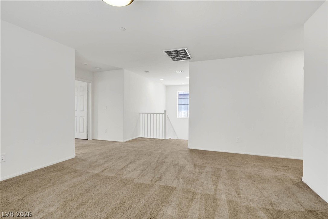 155 Fulgora Street Henderson, NV 89074 - Photo 7 of 30 A spacious, naturally illuminated loft provides an adaptable area for living or work.