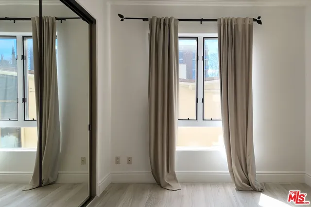 a view of front door with wooden floor