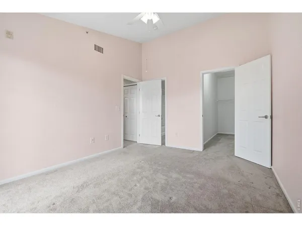 a view of an empty walk in closet