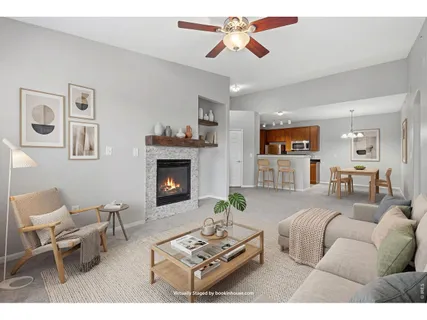 a view of empty room with a fireplace