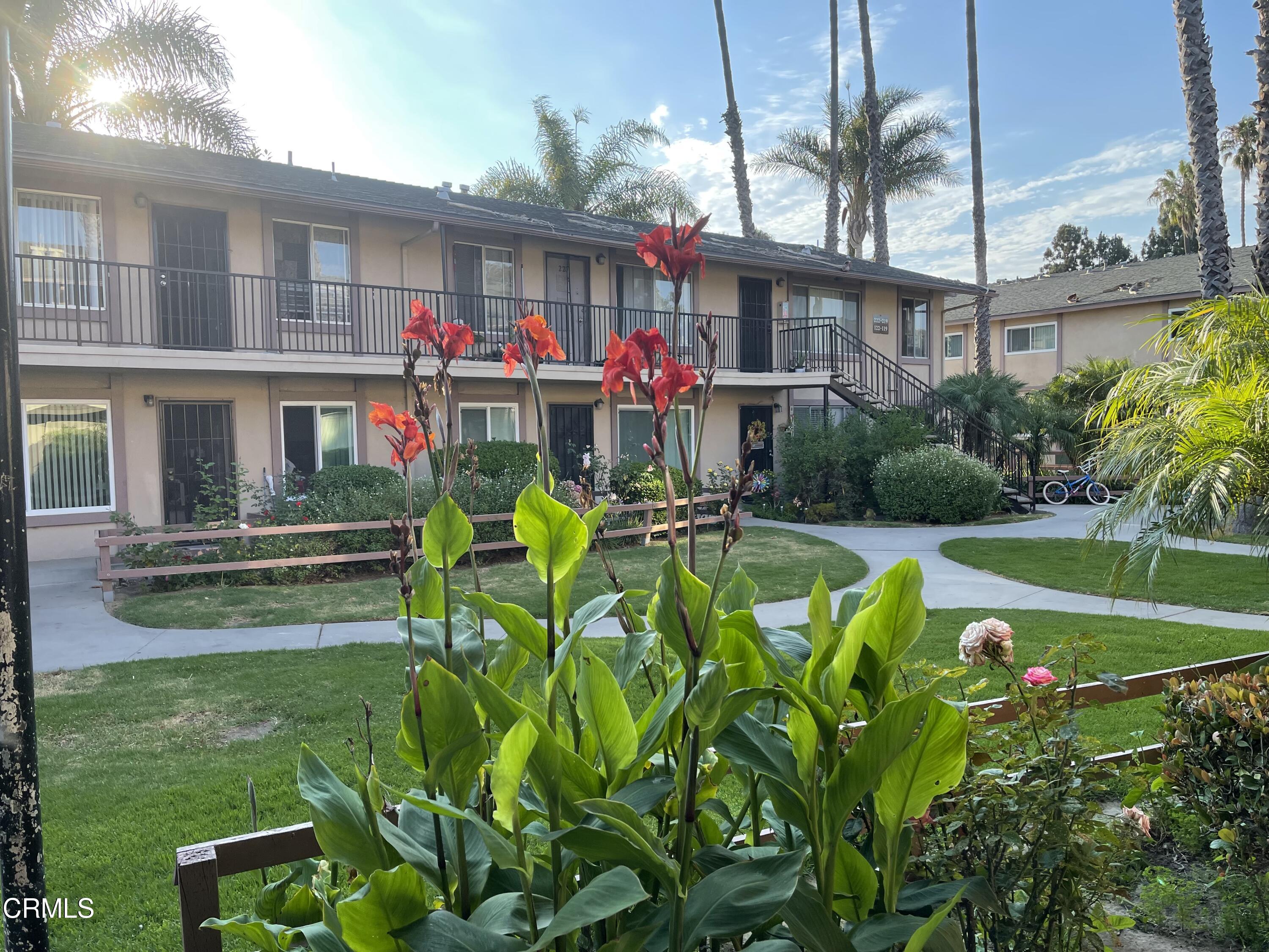 1925 Ginger Street, Unit 102 Oxnard, CA 93036 - Photo 4 of 10 Front with red flower