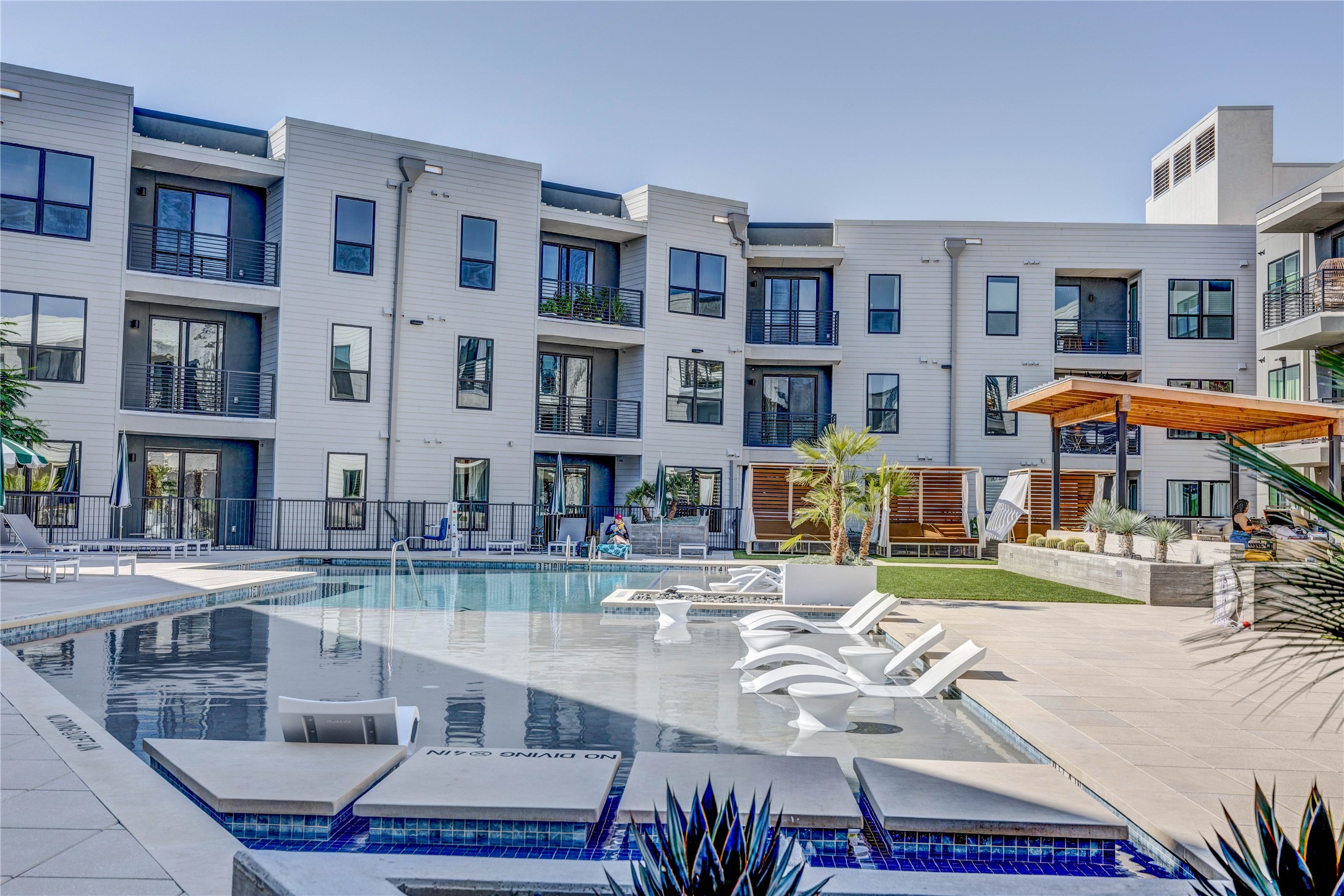 1701 Simond Avenue, Unit 301 Austin, TX 78723 - Photo 22 of 26 a view of a patio with swimming pool table and chairs