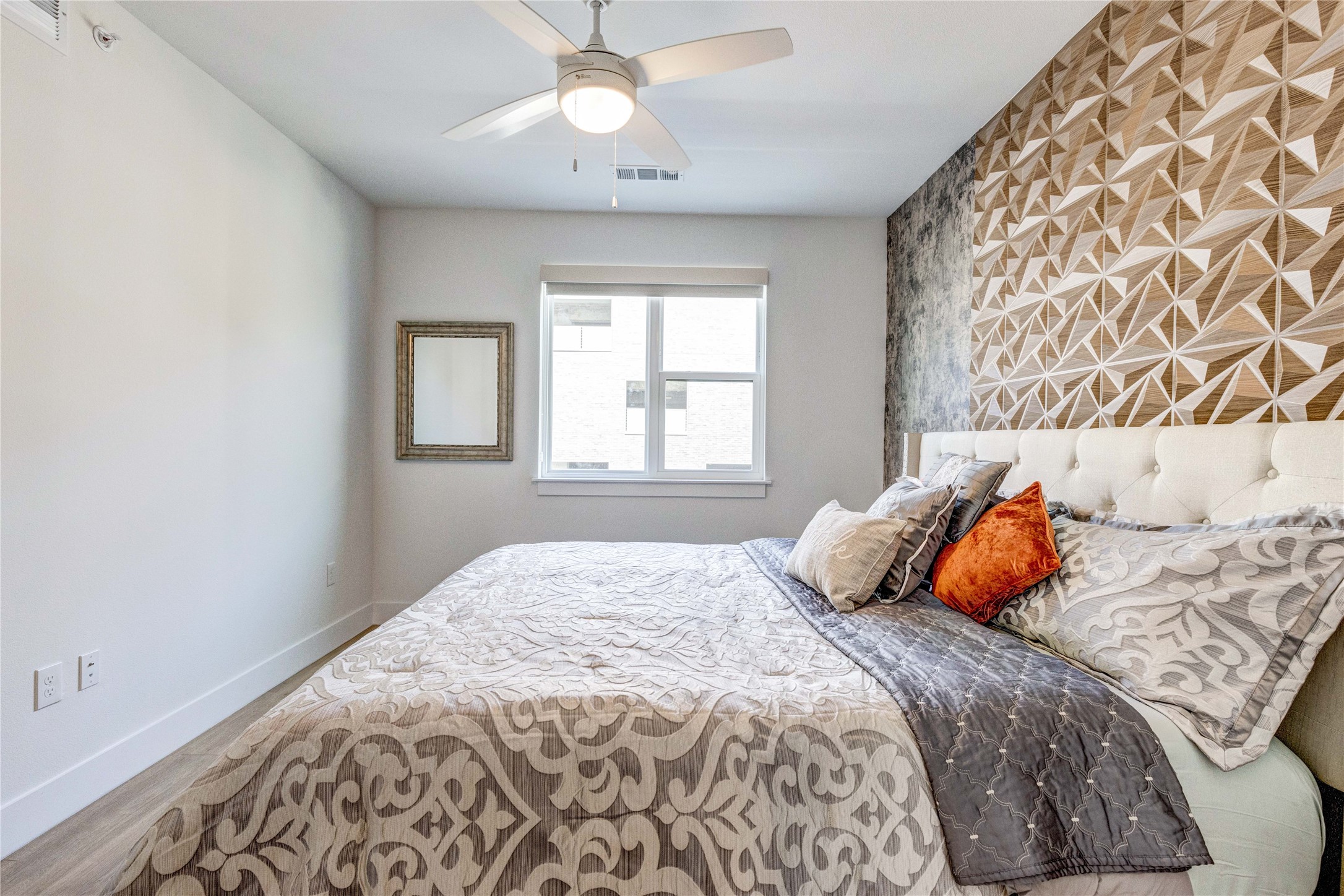 1701 Simond Avenue, Unit 301 Austin, TX 78723 - Photo 5 of 26 a bedroom with a bed and window