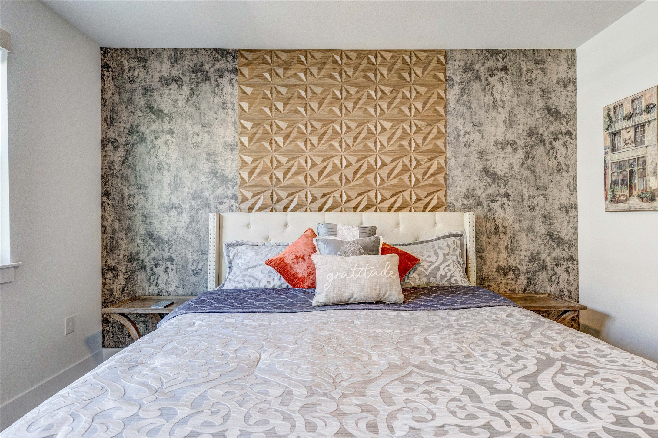 1701 Simond Avenue, Unit 301 Austin, TX 78723 - Photo 6 of 26 a bedroom with a bed and a painting on the wall