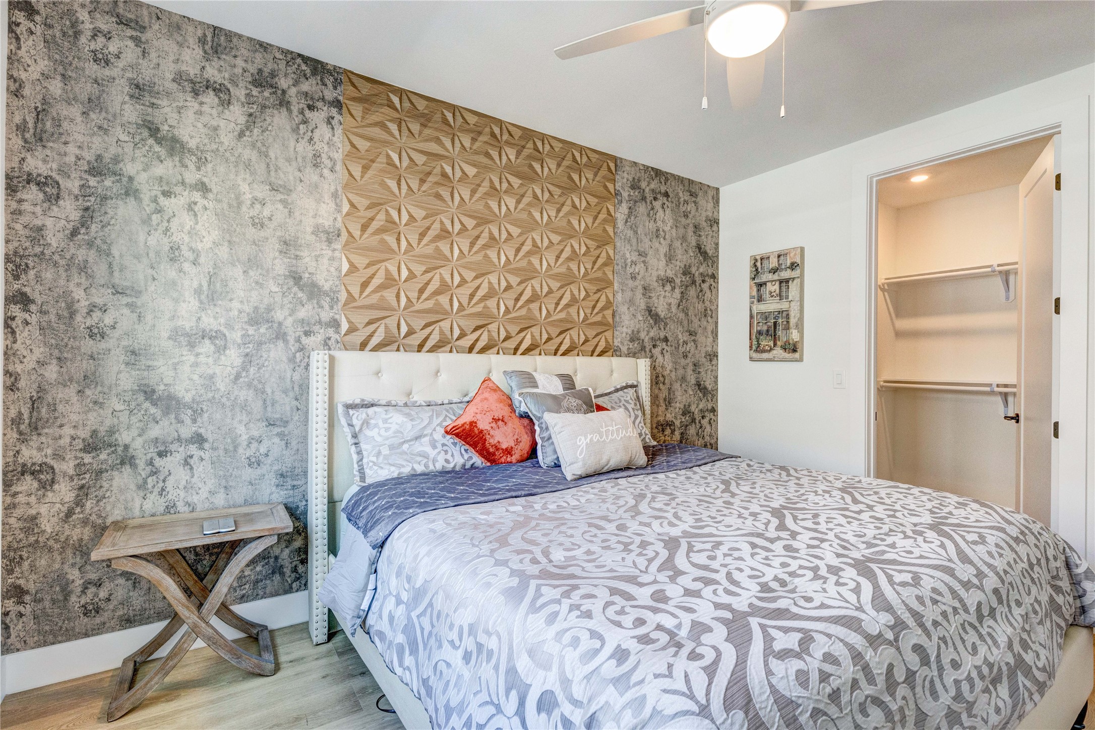 1701 Simond Avenue, Unit 301 Austin, TX 78723 - Photo 7 of 26 a bedroom with a bed and a chandelier