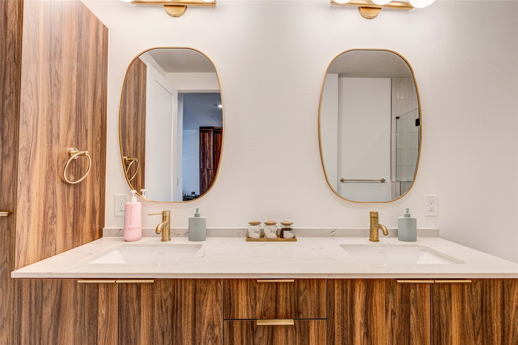 1701 Simond Avenue, Unit 301 Austin, TX 78723 - Photo 9 of 26 a bathroom with a double vanity sink and a mirror