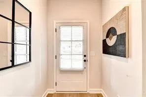 a view of entryway with wooden floor