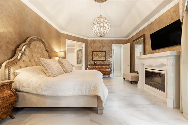 a white bath tub sitting in a bathroom next to a window