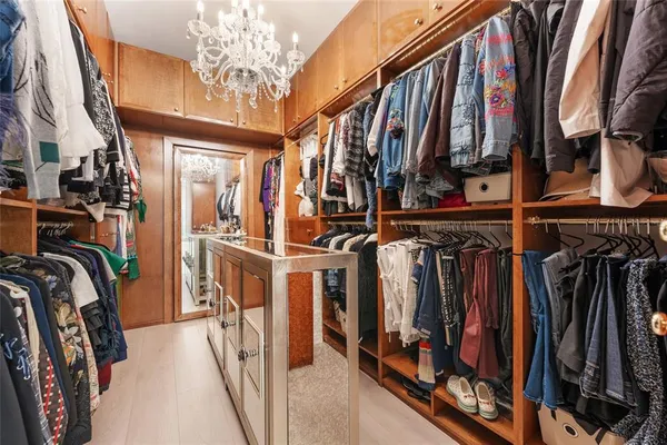 a stove top oven sitting inside of a kitchen