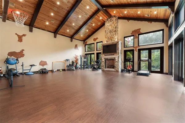 a kitchen with stainless steel appliances granite countertop wooden cabinets a stove and a granite counter top